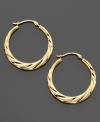 Whip up your style with these lovely swirl hoop earrings crafted in 14k gold. Approximate diameter: 3/4 inch.