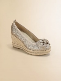 Glittery fabric with a pretty front bow sits atop an oh-so-chic rope-wrapped wedge heel.Glitter fabric upperFront bowRope-covered wedgePadded insoleComposite rubber soleMicrosuede fabric liningImported Glittery fabric with a pretty front bow sits atop an oh-so-chic rope-wrapped wedge heel.Glitter fabric upperFront bowRope-covered wedgePadded insoleComposite rubber soleMicrosuede fabric liningImported