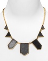 Designed by Nicole Richie, this 14 kt. yellow gold-plated black leather drop necklace looks current and fun with any look.
