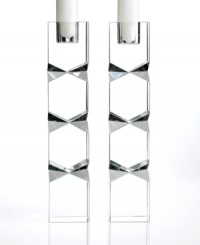 Towers of geometric cut crystal, these Lighting by Design candlesticks boast modern style with a dazzling edge. A chic set for the bride-to-be. Towers of geometric cut crystal, these Lighting by Design candlesticks boast modern style with a dazzling edge. A chic set for the bride-to-be.