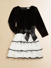 A festive, party-perfect frock rendered in plush velvet with a pleated, organdy ribbon skirt.Round necklineLong sleevesBack zipperWaistband with sash and bow detailTiered skirtBodice: 90% polyester/10% spandexSkirt: PolyesterHand washImported A festive, party-perfect frock rendered in plush velvet with a pleated, organdy ribbon skirt.Round necklineLong sleevesBack zipperWaistband with sash and bow detailTiered skirtBodice: 90% polyester/10% spandexSkirt: PolyesterHand washImported