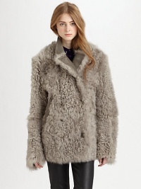 Alarmingly chic jacket of plush shearling has a double-breasted front and soft leather trim. Notched leather collarDouble-breasted button frontLong sleevesDual slash pockets with leather trimAbout 31 from shoulder to hemLamb leather with genuine washed and dyed shearlingFur origin: TurkeyDry clean with fur specialistImportedModel shown is 5'10 (177cm) wearing US size 4. Alarmingly chic jacket of plush shearling has a double-breasted front and soft leather trim. Notched leather collarDouble-breasted button frontLong sleevesDual slash pockets with leather trimAbout 31 from shoulder to hemLamb leather with genuine washed and dyed shearlingFur origin: TurkeyDry clean with fur specialistImportedModel shown is 5'10 (177cm) wearing US size 4.
