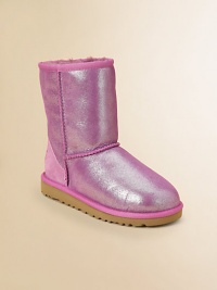 Glitter adorns this update on the original Ugg design, in sheepskin to keep feet warm, dry and in style all season long.Pull-on styleSheepskin upperSheepskin liningMolded EVA sole is light and flexiblePadded insoleImported Glitter adorns this update on the original Ugg design, in sheepskin to keep feet warm, dry and in style all season long.Pull-on styleSheepskin upperSheepskin liningMolded EVA sole is light and flexiblePadded insoleImported