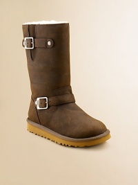 Warm and super comfy, this fashionable look features buckled straps with antique hardware and embossed signature.Leather upper Buckled strap closure EVA outsole Sheepskin insole Imported Warm and super comfy, this fashionable look features buckled straps with antique hardware and embossed signature.Leather upper Buckled strap closure EVA outsole Sheepskin insole Imported