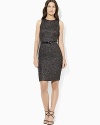 A flattering empire waist and accompanying belt add extra charm to a quintessential little black dress.