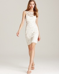 Resplendent with light-catching sequins and beads, this Sue Wong dress is elaborately rendered in lace for an evening look of pure opulence. Resplendent with light-catching sequins and beads, this Sue Wong dress is elaborately rendered in lace for an evening look of pure opulence.
