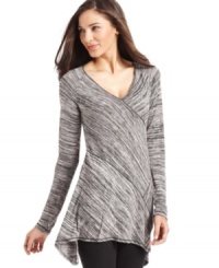 A flattering V-neck and flared asymmetrical hem combine on Studio M's latest top. A flattering V-neck and flared asymmetrical hem combine on Studio M's latest top.