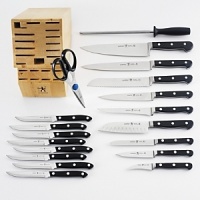 This classic cutlery set is made of hot dropped forged no-stain steel. It is hand honed, is heavy weight stamped and has a full bolster. The handle features three tubular compression rivets. Set includes: 2.5 peeler, 4 parer, 5 serrated utility, 5 hollow edge santoku, 5.5 boning, 6 utility, 7 bread, 8 chef's, 8 carver, set of eight steak knives, 9 sharpening steel, kitchen shears and hardwood block. This classic cutlery set is made of hot dropped forged no-stain steel. It is hand honed, is heavy weight stamped and has a full bolster. The handle features three tubular compression rivets. Set includes: 2.5 peeler, 4 parer, 5 serrated utility, 5 hollow edge santoku, 5.5 boning, 6 utility, 7 bread, 8 chef's, 8 carver, set of eight steak knives, 9 sharpening steel, kitchen shears and hardwood block.