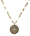 A boho-chic treat for the season. This Lucky Brand necklace features semi-precious reconstituted beads at the chain and mother-of-pearl stones at the gold tone hammered pendant. Crafted in gold tone mixed metal. Approximate length: 29 inches + 2 inch extension. Approximate drop: 2-3/4 inches.