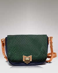 Textured detailing ups the exotic factor on this leather Treesje crossbody, which feels day-to-night right styled against cool girl staples: dark denim and booties. Textured detailing ups the exotic factor on this leather Treesje crossbody, which feels day-to-night right styled against cool girl staples: dark denim and booties.