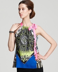 Embark on a quest to eclectic-chic with this Elie Tahari blouse, flaunting a vibrant cascade of print finished with an alluring neon neckline. Embark on a quest to eclectic-chic with this Elie Tahari blouse, flaunting a vibrant cascade of print finished with an alluring neon neckline.