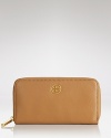 Tory Burch goes continental with this luxe, logo-topped leather wallet.
