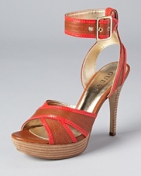Orange patent trim adds a pop of color to the Belvar sandals from GUESS. Orange patent trim adds a pop of color to the Belvar sandals from GUESS.