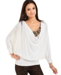 Pairing an embellished neckline with a billowy, draped bodice, Baby Phat delivers a top that makes major impact. Pairing an embellished neckline with a billowy, draped bodice, Baby Phat delivers a top that makes major impact.