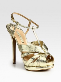 Glimmering lace-print metallic leather design features an adjustable ankle strap and island platform. Self-covered heel, 5 (125mm)Island platform, 1½ (40mm)Compares to a 3½ heel (90mm)Lace-print metallic leather upperLeather lining and solePadded insoleMade in ItalyOUR FIT MODEL RECOMMENDS ordering one size up as this style runs small. Glimmering lace-print metallic leather design features an adjustable ankle strap and island platform. Self-covered heel, 5 (125mm)Island platform, 1½ (40mm)Compares to a 3½ heel (90mm)Lace-print metallic leather upperLeather lining and solePadded insoleMade in ItalyOUR FIT MODEL RECOMMENDS ordering one size up as this style runs small.