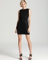 Gunmetal studs--some spiked, some flat--exude edge on this ABS by Allen Schwartz sheath dress.