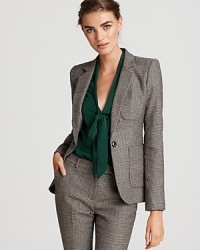 A wool Rachel Zoe suit jacket in always-cool plaid is cut with three patch pockets for a modern update to your office repertoire. A wool Rachel Zoe suit jacket in always-cool plaid is cut with three patch pockets for a modern update to your office repertoire.