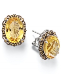 Add a touch of sunshine. These stunning sterling silver earrings highlight an oval-cut citrine (9-1/2 ct. t.w.) and a halo of round-cut yellow Swarovski zirconias (1/2 ct. t.w.). Approximate length: 3/4 inch. Approximate width: 1/2 inch. Add a touch of sunshine. These stunning sterling silver earrings highlight an oval-cut citrine (9-1/2 ct. t.w.) and a halo of round-cut yellow Swarovski zirconias (1/2 ct. t.w.). Approximate length: 3/4 inch. Approximate width: 1/2 inch.