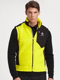 The perfect topper for cool-weather activities, a sporty vest is designed for lightweight warmth and performance.Zip frontStand collarZippered chest, side pocketsAbout 26 from shoulder to hemFace: 52% acrylic/ 48% polyesterBack: PolyesterMachine washImported The perfect topper for cool-weather activities, a sporty vest is designed for lightweight warmth and performance.Zip frontStand collarZippered chest, side pocketsAbout 26 from shoulder to hemFace: 52% acrylic/ 48% polyesterBack: PolyesterMachine washImported