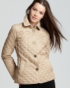 Diamond quilting adds sophisticated polish to this classic Burberry Brit jacket.