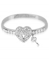 Keep your heart open with lovely hinge bangle bracelet from Betsey Johnson. A heart and key design is prettied up with crystal accents. Includes signature gift box (4 diameter). Crafted in silver tone mixed metal. Approximate diameter: 2-1/3 inches.