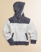 A cotton hoodie with colorblock appeal. Plus, it offers convenient front pockets and zipper front.Attached hoodLong sleevesFront yokeFront zipperSlash pocketsBack yokeCottonMachine washImported