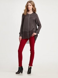 Shimmering, silk-like crewneck has a hidden button front, buttoned cuffs and a sheer hi-low hem. CrewneckLong sleeves with buttoned cuffsHidden button frontSemi-sheer hi-lo hemPolyester charmeuseDry cleanMade in USA of imported fabricModel shown is 5'10 (177cm) wearing US size Small. Shimmering, silk-like crewneck has a hidden button front, buttoned cuffs and a sheer hi-low hem. CrewneckLong sleeves with buttoned cuffsHidden button frontSemi-sheer hi-lo hemPolyester charmeuseDry cleanMade in USA of imported fabricModel shown is 5'10 (177cm) wearing US size Small.
