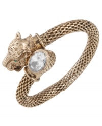 Fiercely fashionable. Carolee's elegant wrap bangle features a panther head with green glass eyes and an oval-cut clear glass accent. Set in textured antique gold tone mixed metal. Approximate diameter: 2-1/4 inches. Fiercely fashionable. Carolee's elegant wrap bangle features a panther head with green glass eyes and an oval-cut clear glass accent. Set in textured antique gold tone mixed metal. Approximate diameter: 2-1/4 inches.