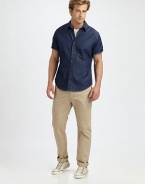 This trim-fitting cotton denim style works well on weekends, the perfect alternative to a polo.Point collarButton front Short sleevesShirttail hemCottonMachine washImported