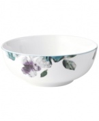 Watercolor florals adorn the canvas of white porcelain that is Mikasa's Paradise Bloom cereal bowl. A simple silhouette and band of blue complete this essential part of the everyday dinnerware collection.
