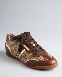 Of course you'll want to work out--or just walk about--in these MICHAEL Michael Kors sneakers. Luxe logo patterns, gold and suede all spell style. Of course you'll want to work out--or just walk about--in these MICHAEL Michael Kors sneakers. Luxe logo patterns, gold and suede all spell style.