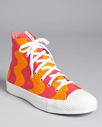In a wavy, geometric Marimekko fabric, these Converse sneakers showcase an exciting collaboration between two iconic brands. In a wavy, geometric Marimekko fabric, these Converse sneakers showcase an exciting collaboration between two iconic brands.