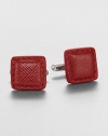 Distinctive cuff links crafted of textured leather. About 0.6 squareMade in Italy
