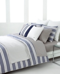 Redefine the look of your bedroom with these sophisticated stripes. Broad horizontal lines in vapor blue alternate with pinstripes for a studied, modern look upon rich cotton. Add a few quilted and solid Lacoste accents and you'll feel right at home with this urban bedding collection. Redefine the look of your bedroom with these sophisticated stripes. Broad horizontal lines in vapor blue alternate with pinstripes for a studied, modern look upon rich cotton. Add a few quilted and solid Lacoste accents and you'll feel right at home with this urban bedding collection.