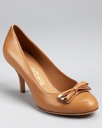 Feminine and refined, the Bettina pump from renowned footwear designer Salvatore Ferragamo is polished and professional. Feminine and refined, the Bettina pump from renowned footwear designer Salvatore Ferragamo is polished and professional.