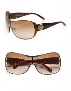 Sleek metal frames with logo accented acetate temples. Available in silver stingray with grey gradient lens or bronze with brown gradient lens. Logo temples100% UV protectionImported