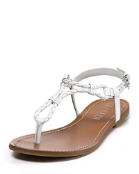Slim, braided leather straps give these simple flats an earthy-cool quality. Wear with anything from summer shorts to sun dresses. Slim, braided leather straps give these simple flats an earthy-cool quality. Wear with anything from summer shorts to sun dresses.