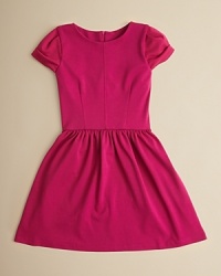 With a contoured bodice, cute cuffed sleeves and a ruffle skirt, this adorable dress looks great at parties and at play. With a contoured bodice, cute cuffed sleeves and a ruffle skirt, this adorable dress looks great at parties and at play.