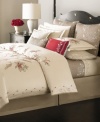 Boasting tonal floral embroidery at center on pure cotton, this Martha Stewart Collection decorative pillow accents Dreamtime Floral bedding with a classic appeal. Features zipper closure.
