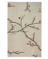 Slender branches sprout red and gold buds on an area rug that lets you enjoy the beauty of spring all year round. Hand-tufted in India by skilled artisans, this rug is crafted from sumptuously soft wool with a thick pile that feels heavenly underfoot.