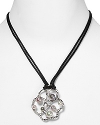 Give looks a sculptural touch with this pendant necklace from Majorica, crafted of sterling silver and finished with a splash of tonal pearls. Give looks a sculptural touch with this pendant necklace from Majorica, crafted of sterling silver and finished with a splash of tonal pearls.