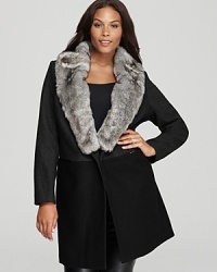 With a plush faux-fur collar and sumptuous oversized silhouette, this DKNYC Plus coat lends luxe appeal to your cold-weather collection. With a plush faux-fur collar and sumptuous oversized silhouette, this DKNYC Plus coat lends luxe appeal to your cold-weather collection.