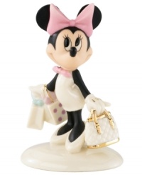 Looking doe-eyed and innocent as can be, Disney's Minnie Mouse pauses to reflect on a very successful shopping spree. A must-have with beautiful glazed and gold detail in Lenox fine china.