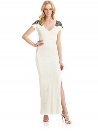THE LOOKV-neckBeaded shoulders with scalloped detailBack cutout with crisscross strapsSide slitsPullover styleTHE FITAbout 60 from shoulder to hemTHE MATERIAL95% rayon/5% spandexFully linedCARE & ORIGINDry cleanImportedModel shown is 5'10½ (179cm) wearing US size Small. THE LOOKV-neckBeaded shoulders with scalloped detailBack cutout with crisscross strapsSide slitsPullover styleTHE FITAbout 60 from shoulder to hemTHE MATERIAL95% rayon/5% spandexFully linedCARE & ORIGINDry cleanImportedModel shown is 5'10½ (179cm) wearing US size Small.