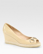 Patent leather wedge with a rope-covered platform, peep toe and buckle adornment. Self-covered wedge, 3 (75mm)Rope-covered platform, 1 (25mm)Compares to a 2 heel (50mm)Patent leather upperLeather liningRubber solePadded insoleMade in Italy