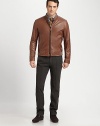 Ribbed knit banding, uniquely placed at the collar, shoulder and hem enhance the blousy effect of this jacket rendered in luxuriously soft lambskin leather.Two-way zip frontStand collarSide slash pocketsRibbed knit collar, shoulder and hem detailFully linedAbout 26 from shoulder to hemLeatherDry cleanImported