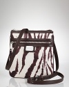 Hit print with this nylon crossbody bag from Lauren Ralph Lauren, boasting bold stripes, leather finishes and a just right size.
