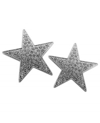 Shine bright, superstar! GUESS's sparkling star-shaped stud earrings dazzle with pave-set glass accents in silver tone mixed metal. Approximate diameter: 1-3/4 inches. Shine bright, superstar! GUESS's sparkling star-shaped stud earrings dazzle with pave-set glass accents in silver tone mixed metal. Approximate diameter: 1-3/4 inches.