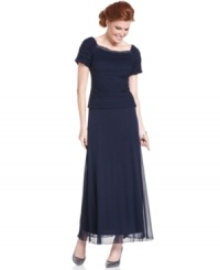Patra's gown is ready to dazzle with a beaded neckline and faux two-piece look, for a style that appears perfectly put together. Patra's gown is ready to dazzle with a beaded neckline and faux two-piece look, for a style that appears perfectly put together.