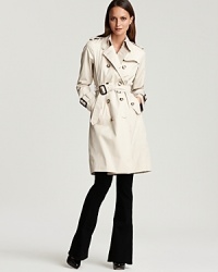 Evoke classic Brit-inspired style in this Burberry London trench -- the must-have piece in every woman's wardrobe. The removable self belt with back D-ring detail cinches the waist for a flattering figure. Evoke classic Brit-inspired style in this Burberry London trench -- the must-have piece in every woman's wardrobe. The removable self belt with back D-ring detail cinches the waist for a flattering figure.